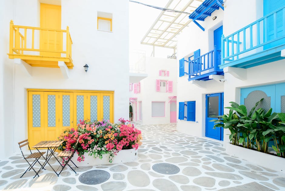 Architekturfotografie Von Drei Rosa, Blauen Und Gelben Geb&auml;uden